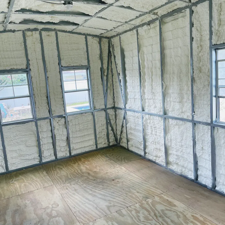 Closed-cell spray foam insulation applied to wall cavities in a residential project in Bella Vista